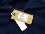 a close up of a blue shirt with a tag on it