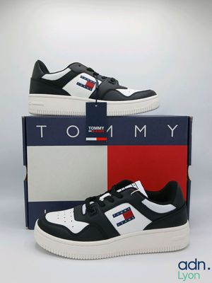 a pair of sneakers with a box on a white background