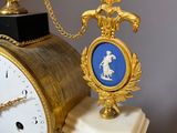 a clock that is sitting on top of a pedestal