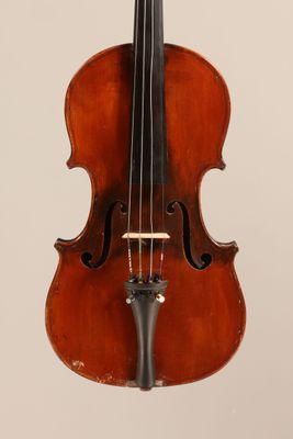an old violin with a bow hanging from it ' s neck