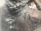 a statue of a man with a chain around his neck