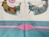 a scarf with a picture of a dog on a sleigh and a horse on a sleigh