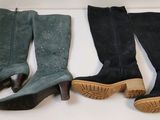 three pairs of women ' s boots are lined up on a shelf
