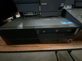 two computers sitting on top of each other on a table