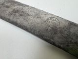 a large knife that is sitting on a table