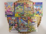 beaucoup de jeux de nintendo wii sur la table