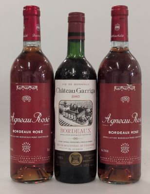 three bottles of wine sitting next to each other on a table