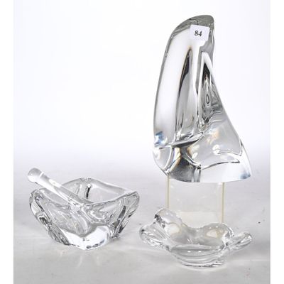 a glass ashtray and a glass ashtray on a table