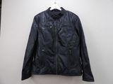 a black leather jacket hanging on a hanger in front of a white wall