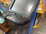 une console de jeux posée devant tout un tas d'autres jeux