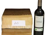 a bottle of wine next to a box of wine