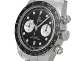 an image of a stainless steel watch with a black dial