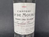 a bottle of wine that is sitting on a table