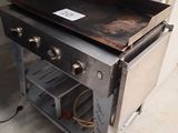 an old stove with a black top in a room