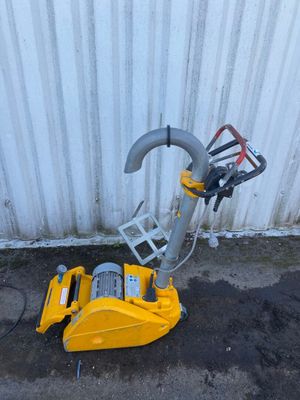 a yellow machine that is sitting on the ground