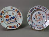 pair of chinese porcelain plates with flowers and birds on them