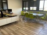 a room with a table, chairs, and a computer on the desk