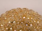 a glass ball that has a lot of beads on it