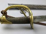 a close up of a pair of swords on a table