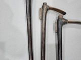 two old tools that are hanging on the wall