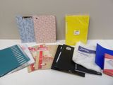 many different types of binders and books on the table