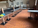 a long row of tables in the middle of a room