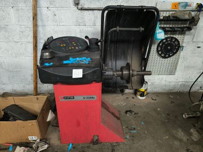 a machine that is sitting in a garage next to a box