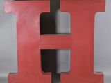 a large red letter h on a white background