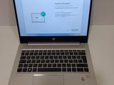 an open laptop computer sitting on top of a white table