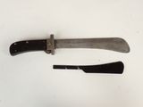 two knives that are laying next to each other on a table