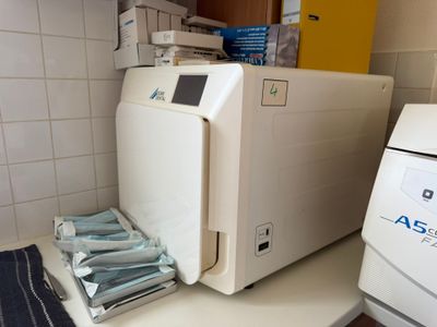 a machine that is sitting on a counter next to a washer
