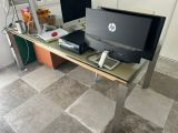 a desk with a computer and a monitor on it