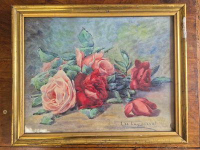 painting of roses in a gold frame on a wooden table