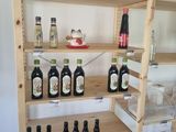 a shelf with bottles of alcohol on it in a room