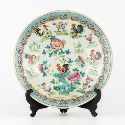 a plate with a bird and flowers design on it