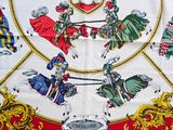 an image of a scarf with a picture of knights on horseback