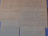 a bunch of old papers sitting on top of a blue table