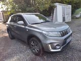 a picture of a silver suv parked in a lot