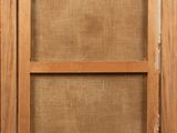 a close up of an old window with a wooden frame