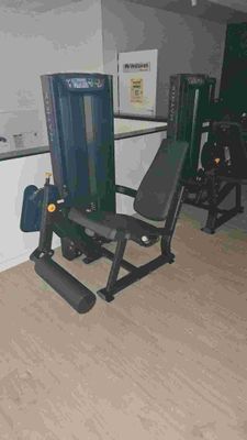 an image of a home gym room with equipment in it
