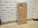 a cardboard box sitting on the floor in front of a wall