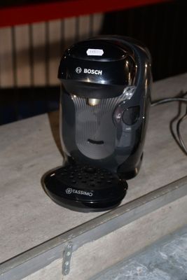 a black coffee maker sitting on top of a counter