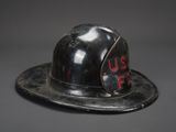 an old fireman ' s helmet with the us fire written on it