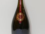 an image of a bottle of champagne sitting on a table