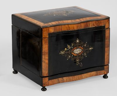 a small wooden box with a decorative decoration on it