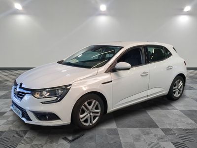 a white car is parked in a room with a checkered floor