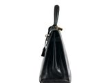 black leather handbag on white background with clipping for text