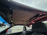 the interior of a car with the sunroof down and the sunroof down
