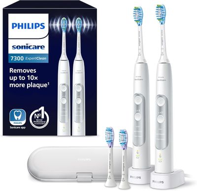 three electric toothbrushes that are in the package