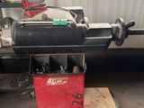 a machine that is sitting on a table in a garage